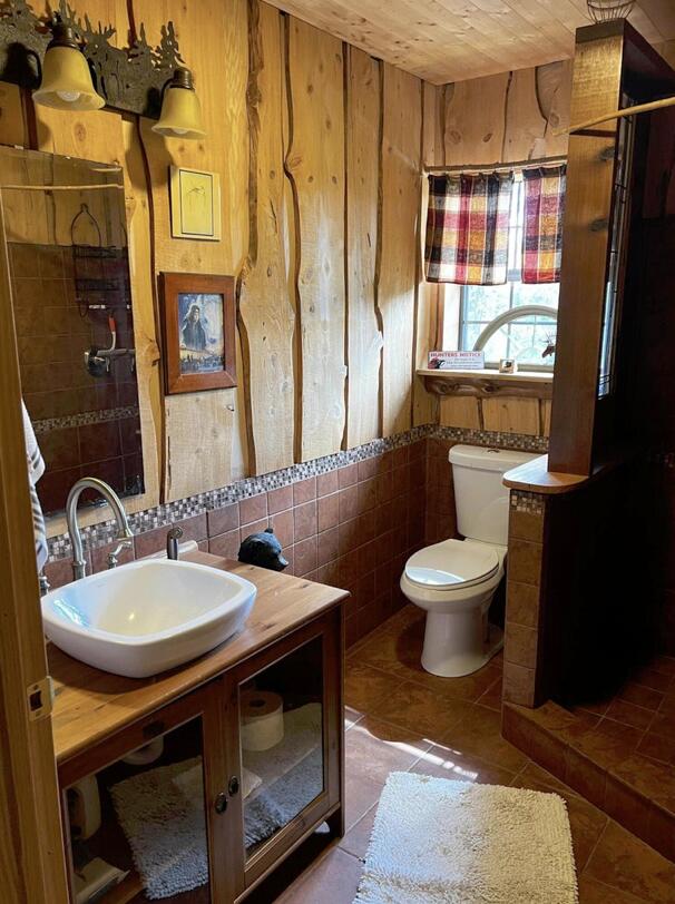 5 West A W Chapel Road Laurel Hill, FL 32567 - Photo 10 of 14 a bathroom with a toilet sink and mirror