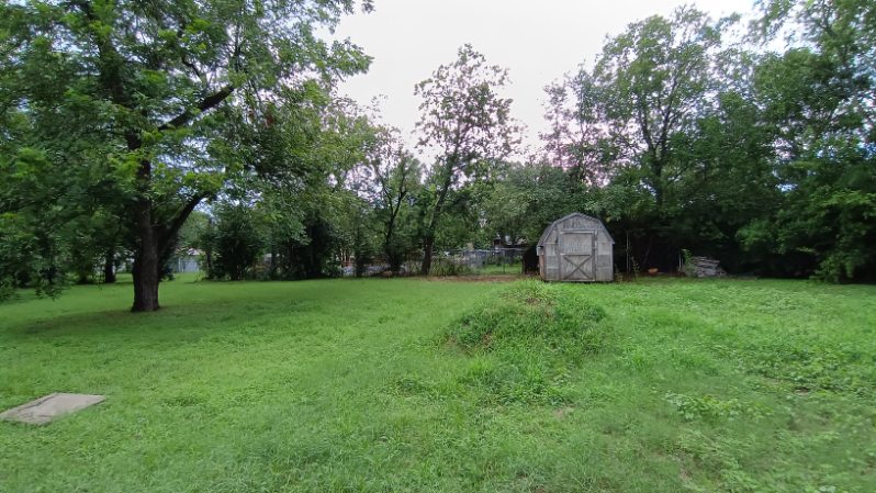 112 Ila Street Elgin, TX 78621 - Photo 18 of 27 a backyard of a house with lots of green space