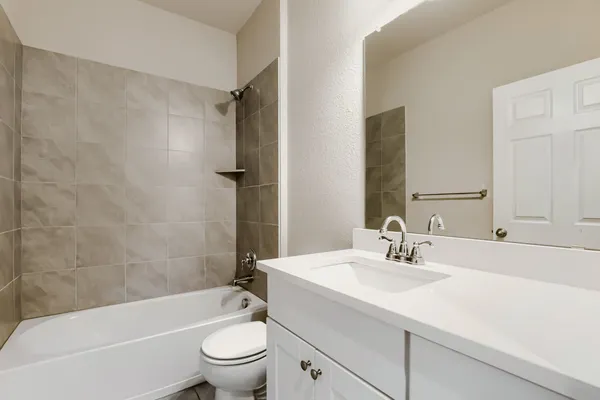 a bathroom with a sink a toilet and a bathtub