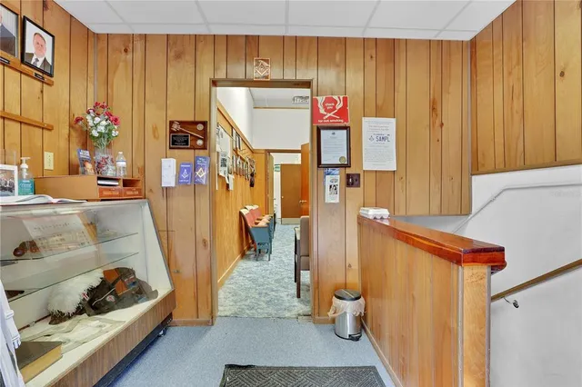 a storage room with wooden floor and furniture