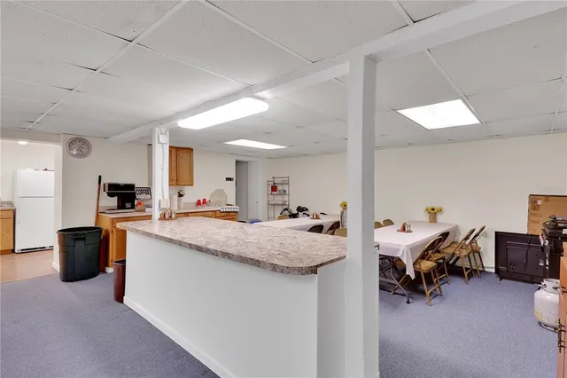 a view of living room filled with furniture and a chandelier