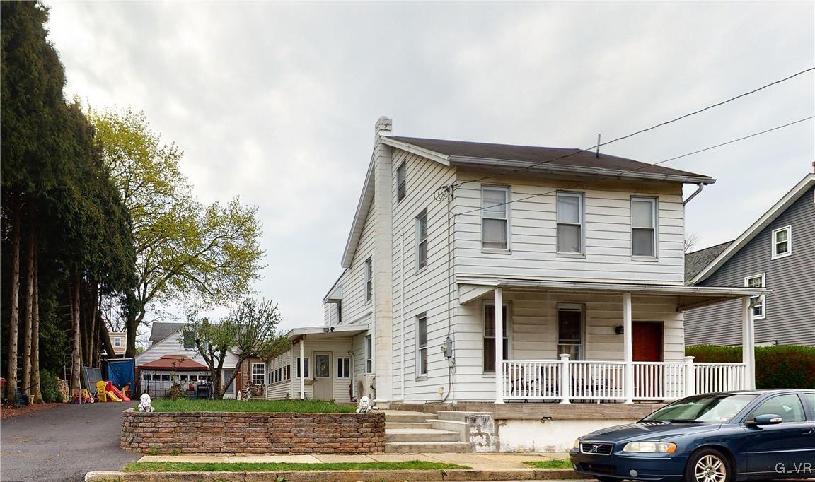 712 2nd Street Catasauqua, PA 18032 - Photo 1 of 36 a front view of a house with garden
