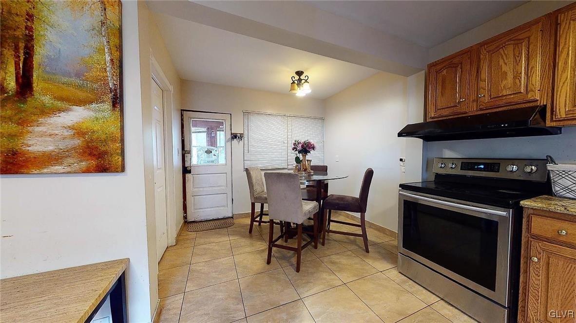 712 2nd Street Catasauqua, PA 18032 - Photo 12 of 36 a view of a dining room with furniture and a kitchen
