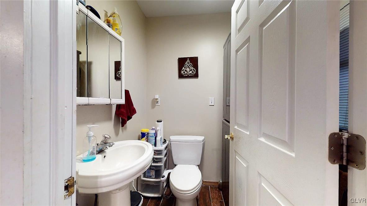 712 2nd Street Catasauqua, PA 18032 - Photo 17 of 36 a white toilet sitting next to a bathroom sink