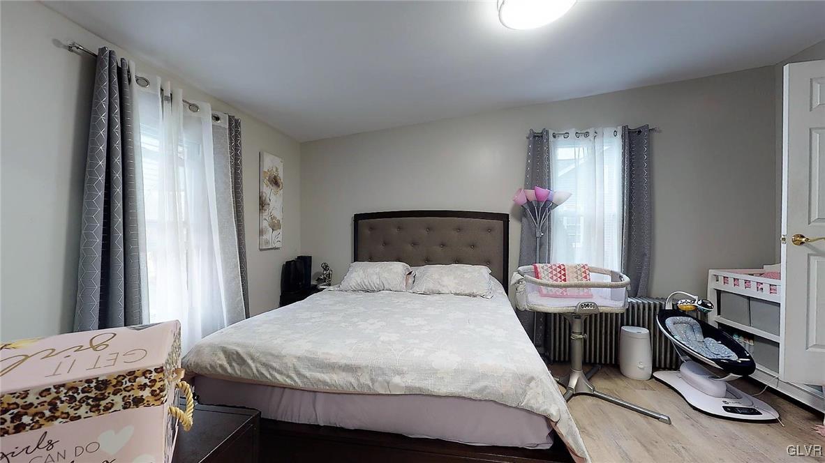 712 2nd Street Catasauqua, PA 18032 - Photo 18 of 36 a bedroom with a bed and a chair