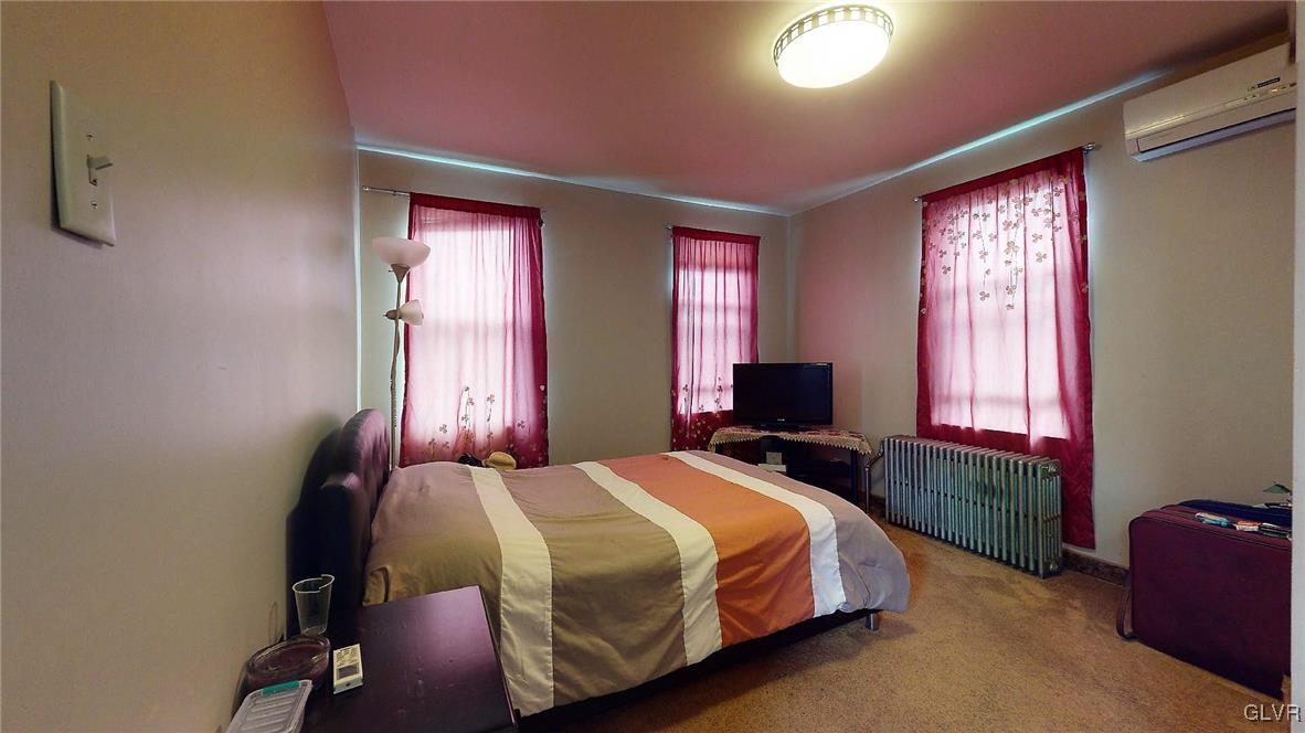 712 2nd Street Catasauqua, PA 18032 - Photo 23 of 36 a bedroom with a bed and a window