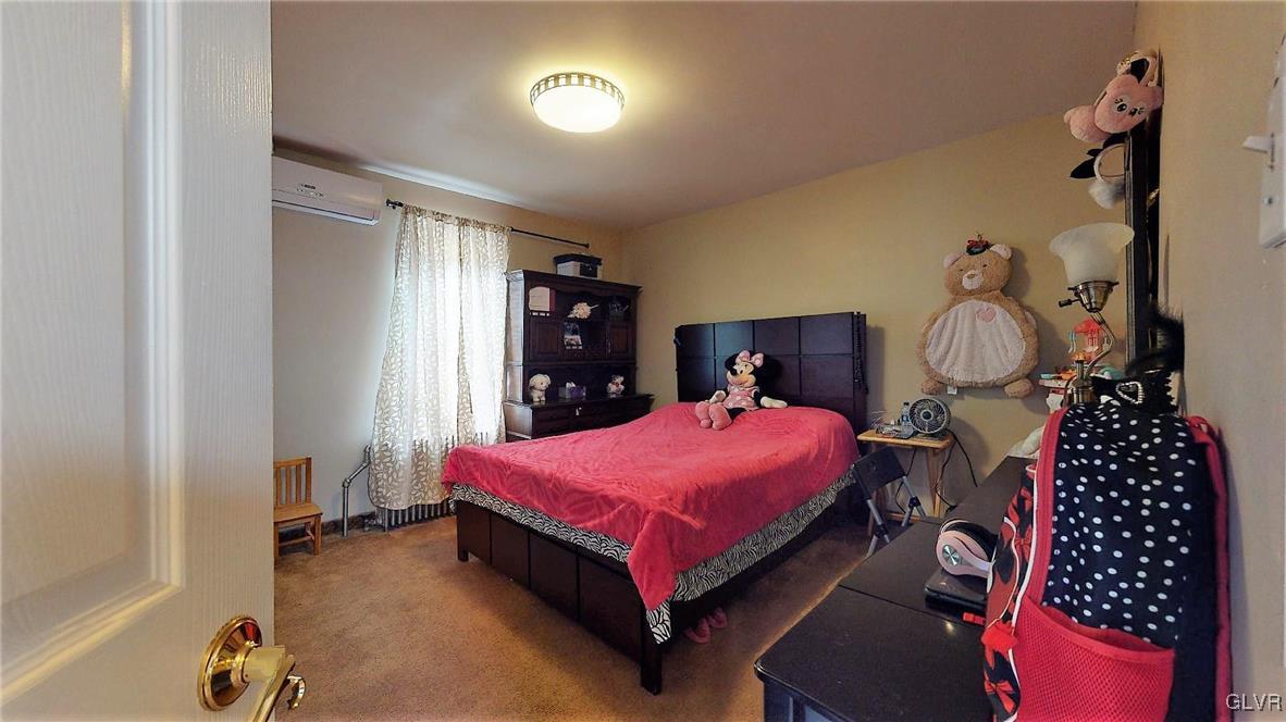 712 2nd Street Catasauqua, PA 18032 - Photo 25 of 36 a bedroom with a bed and a table