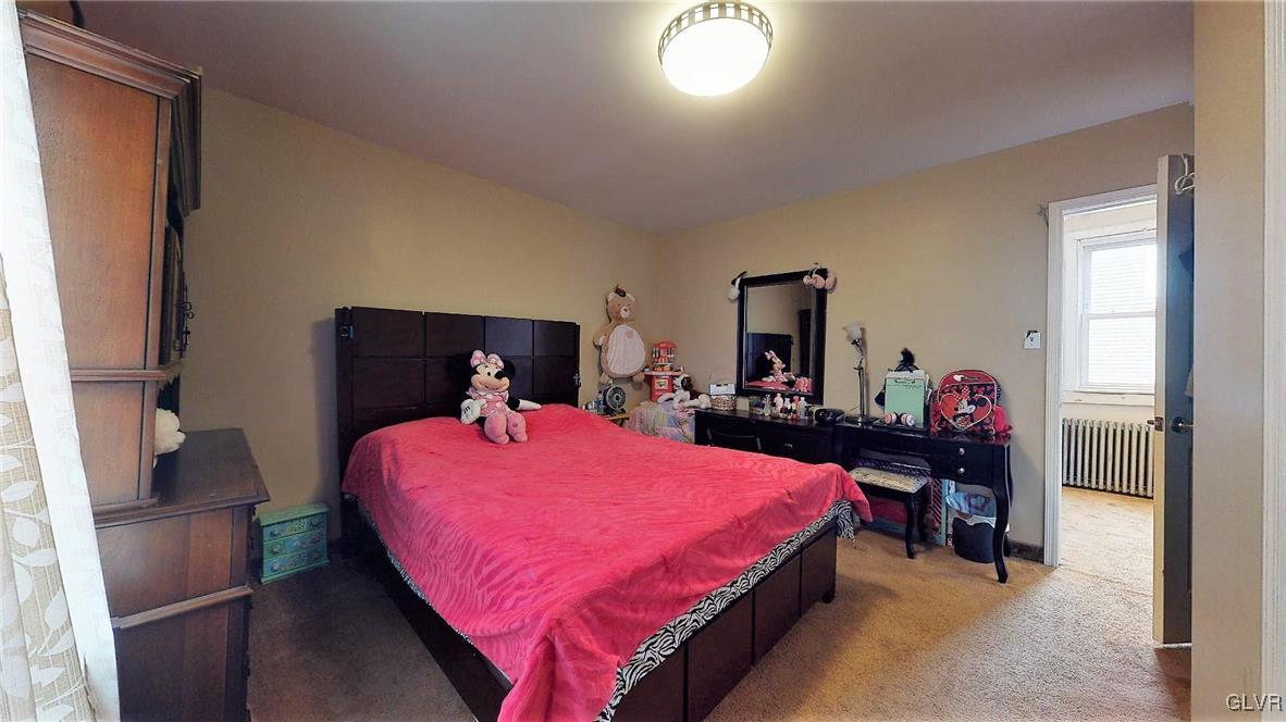 712 2nd Street Catasauqua, PA 18032 - Photo 26 of 36 a bedroom with a bed and a dresser