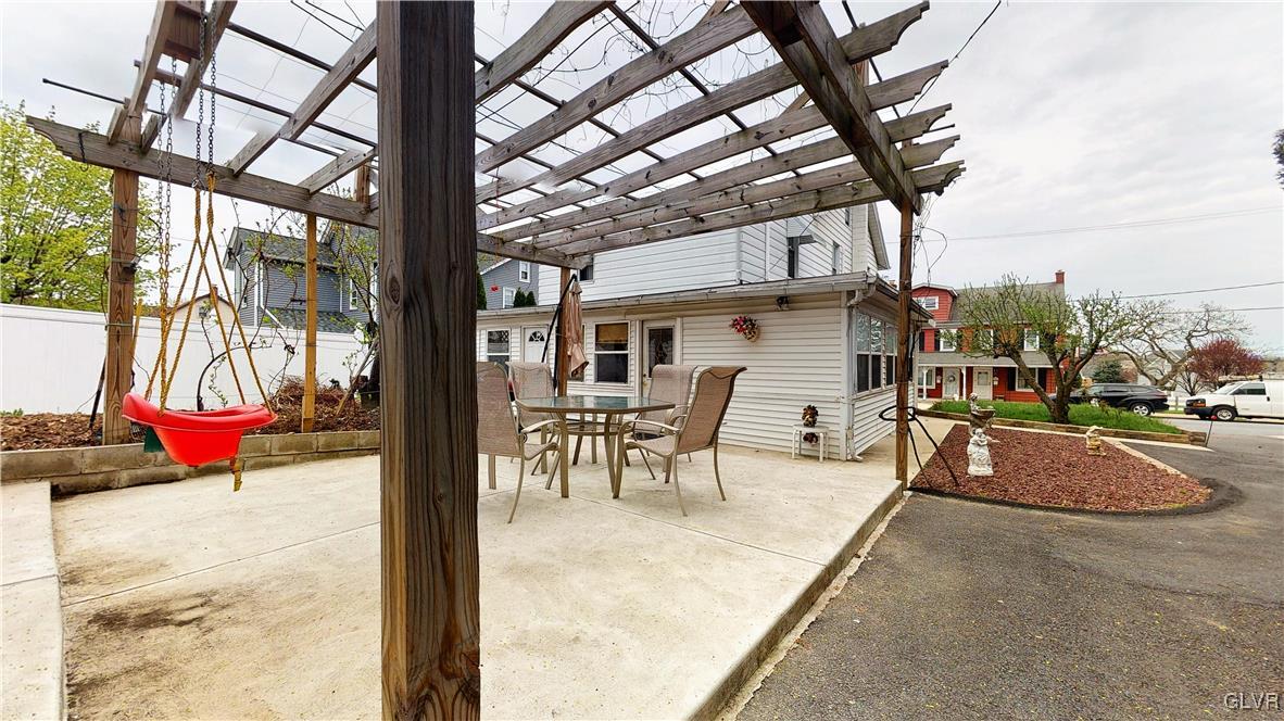 712 2nd Street Catasauqua, PA 18032 - Photo 30 of 36 a view of a patio with table and chairs and floor to ceiling window