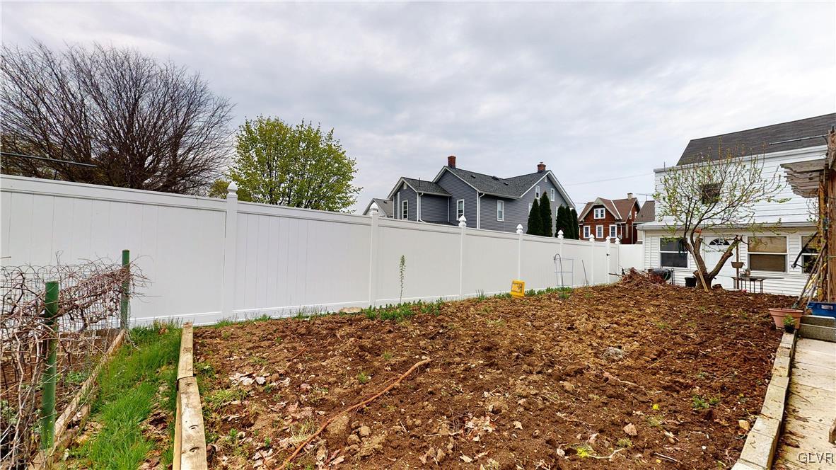 712 2nd Street Catasauqua, PA 18032 - Photo 32 of 36 a view of a house with a large tree and a yard in front of it