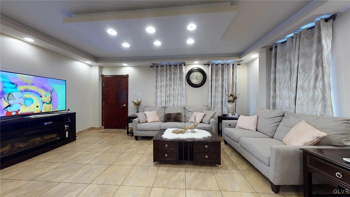 712 2nd Street Catasauqua, PA 18032 - Photo 5 of 36 a living room with furniture and a flat screen tv