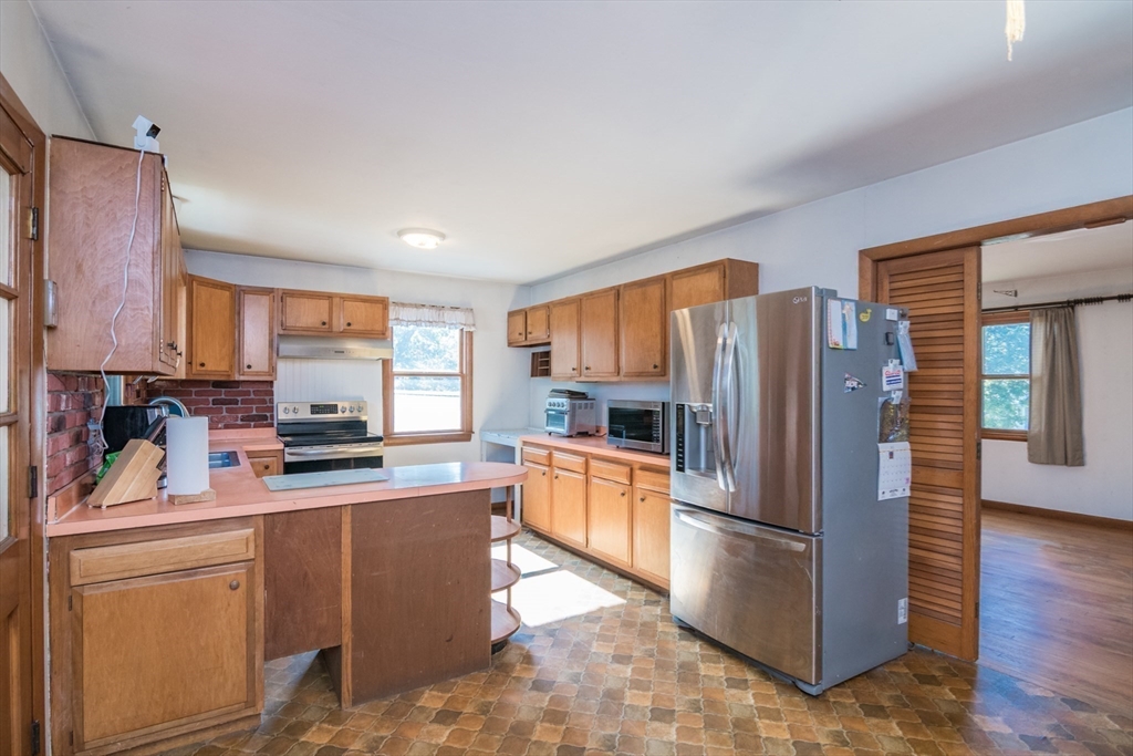 8 Sunset Drive Montague, MA 01376 - Photo 12 of 29 a kitchen with granite countertop a refrigerator stove top oven and sink