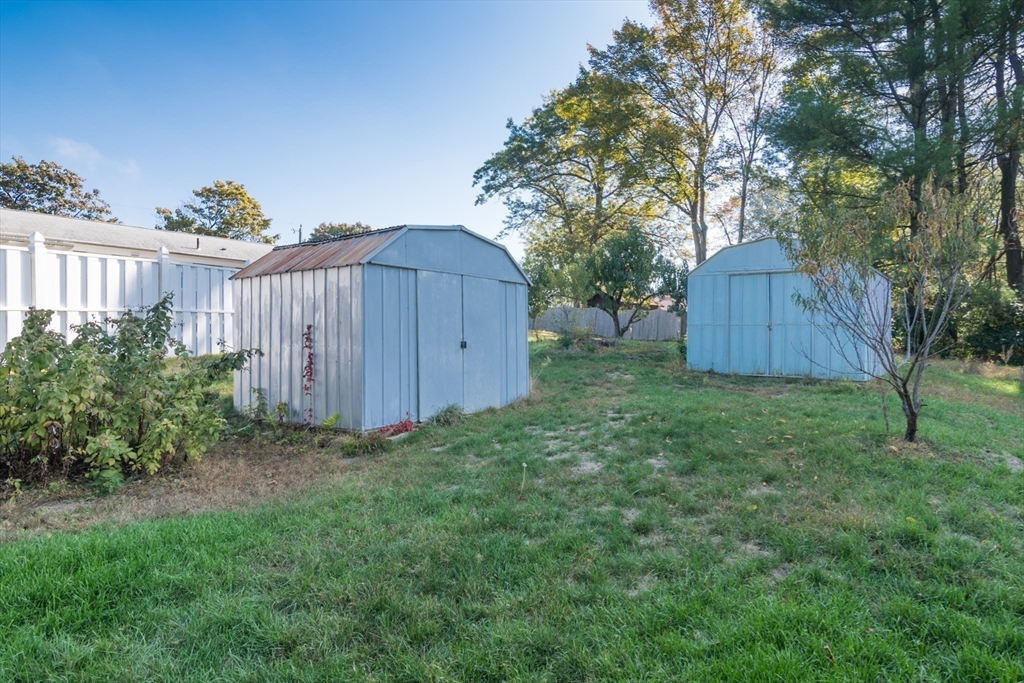 8 Sunset Drive Montague, MA 01376 - Photo 8 of 29 a view of a backyard with potted plants and large tree
