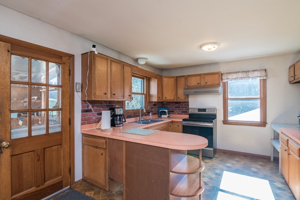 8 Sunset Drive Montague, MA 01376 - Photo 9 of 29 a kitchen with a stove a refrigerator and a sink