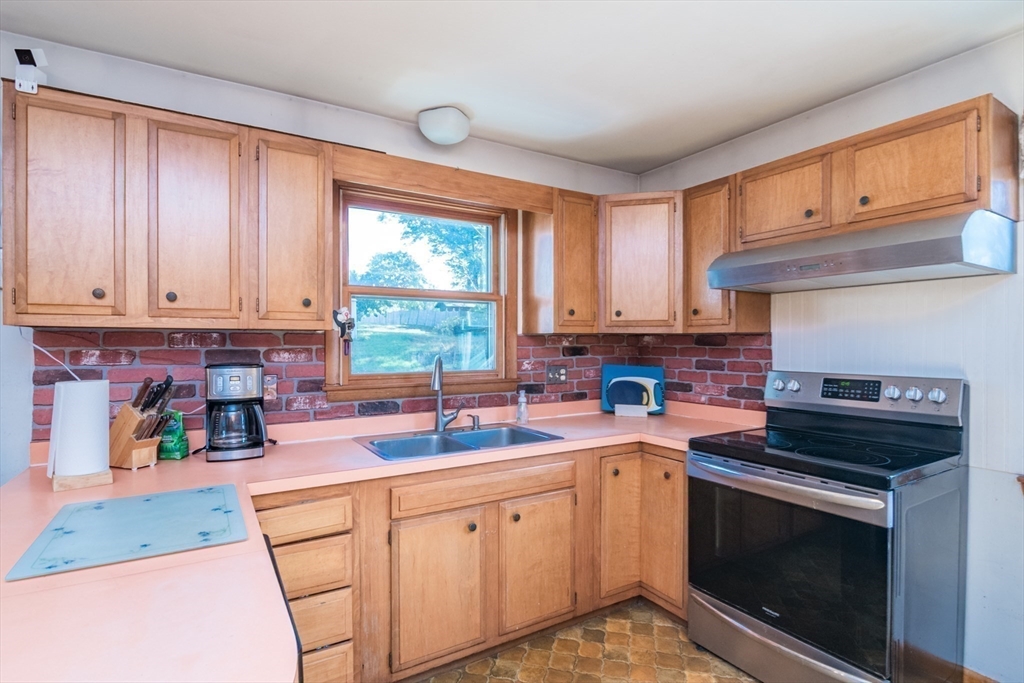 8 Sunset Drive Montague, MA 01376 - Photo 10 of 29 a kitchen with a sink stove top oven and cabinets