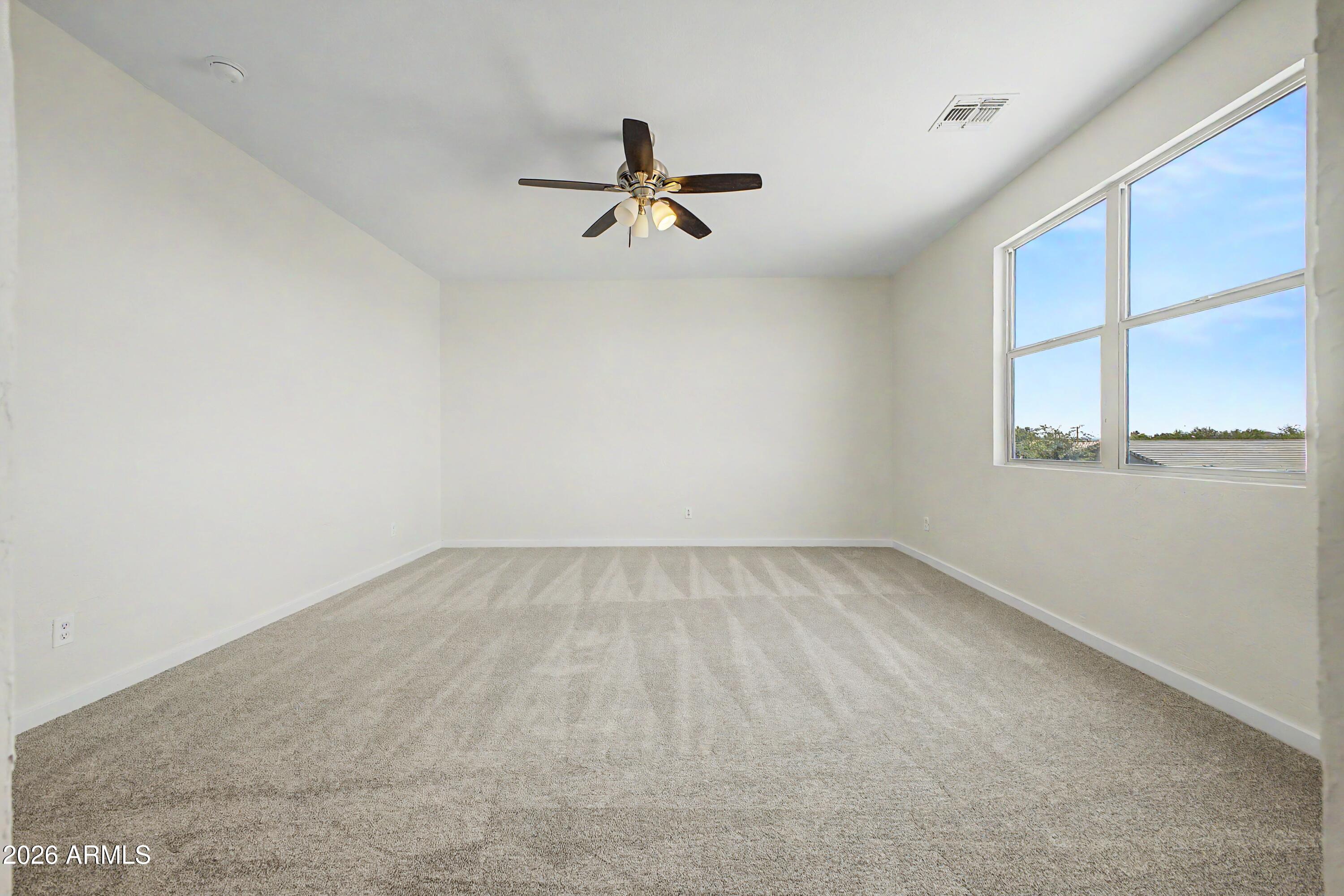 37154 North Navarra Road San Tan Valley, AZ 85140 - Photo 14 of 25 an empty room with a window