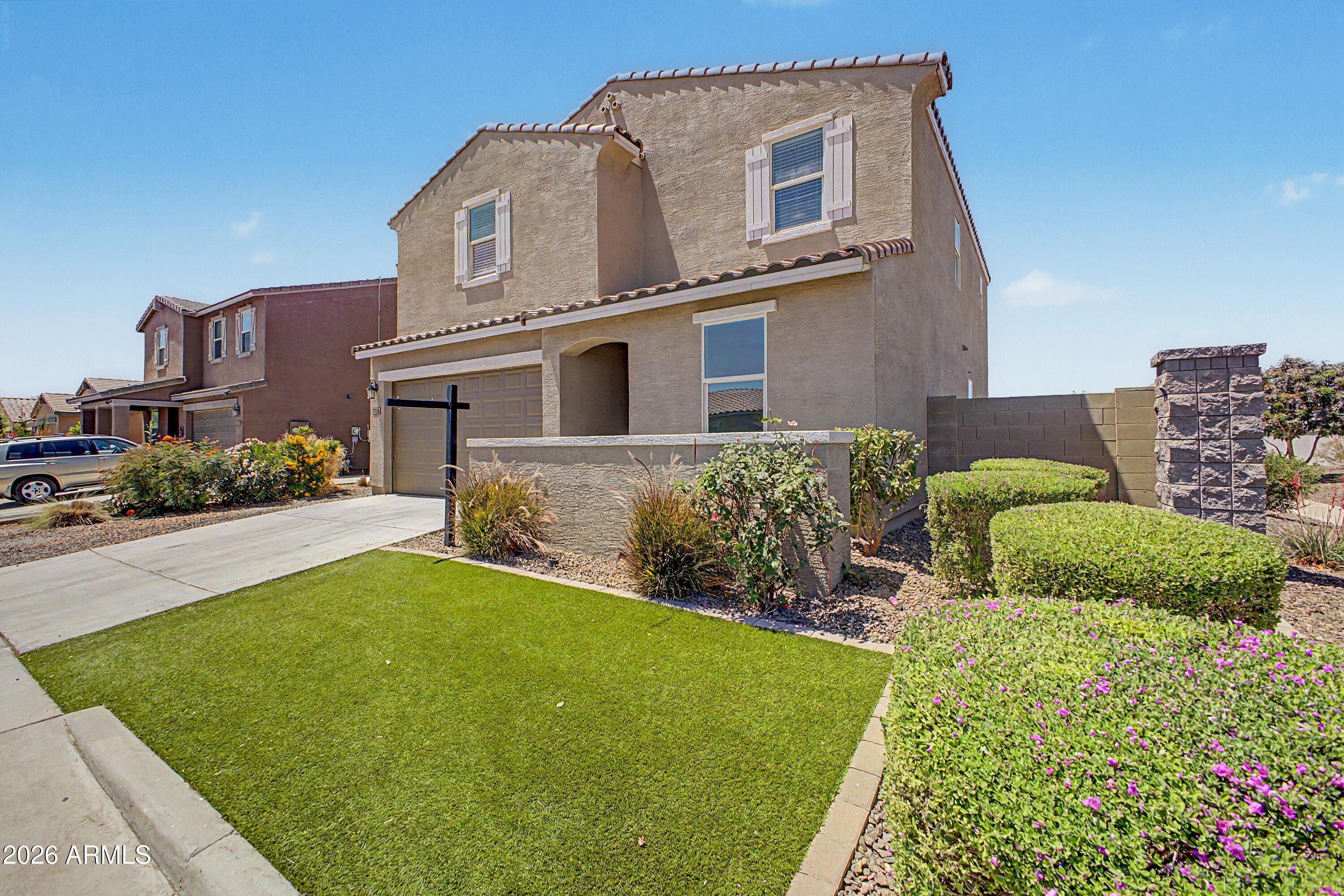 37154 North Navarra Road San Tan Valley, AZ 85140 - Photo 2 of 25 a front view of a house with garden