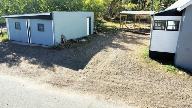 a view of a backyard of the house