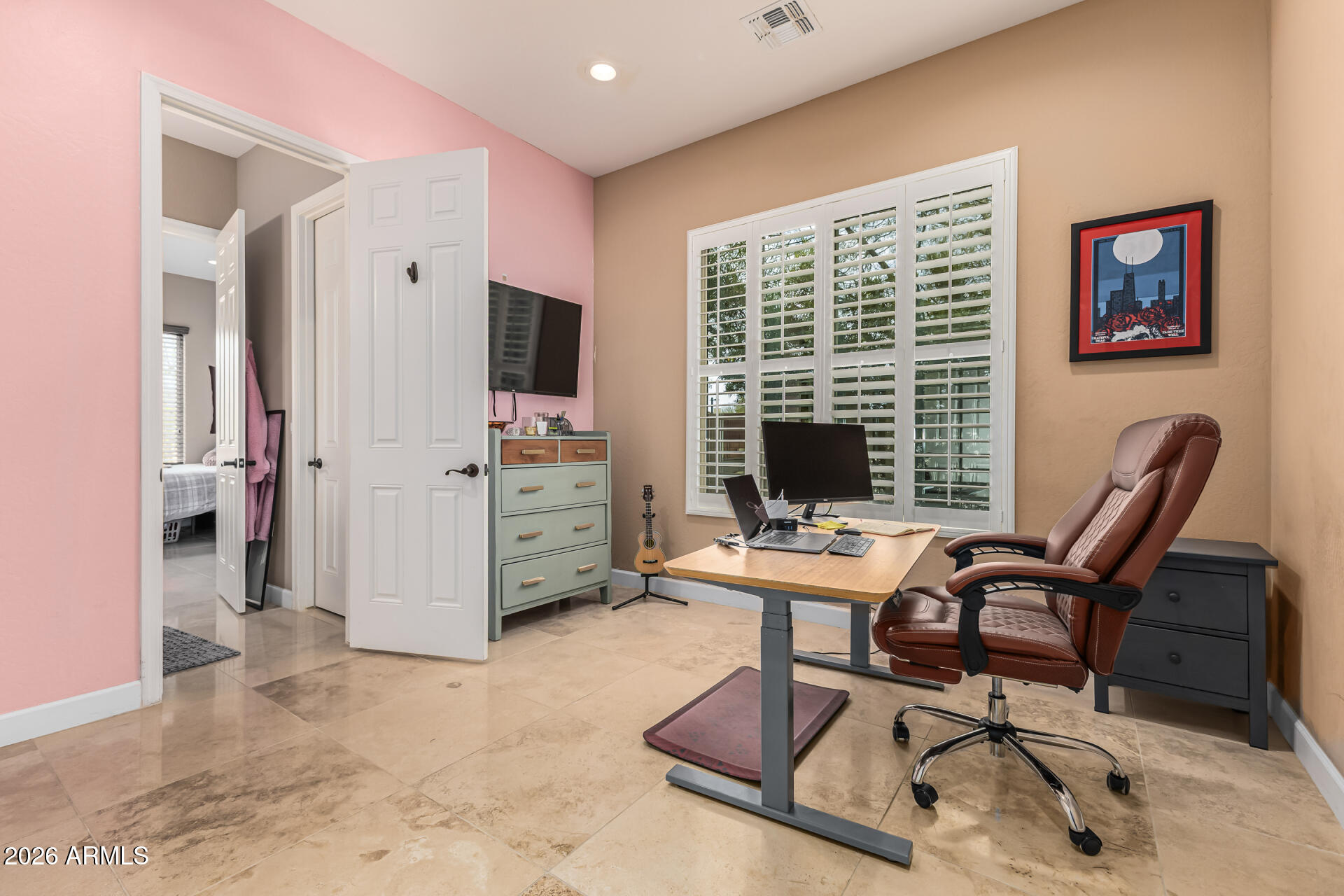 3139 East Harwell Road Phoenix, AZ 85042 - Photo 26 of 45 a view of a workspace with furniture and a window