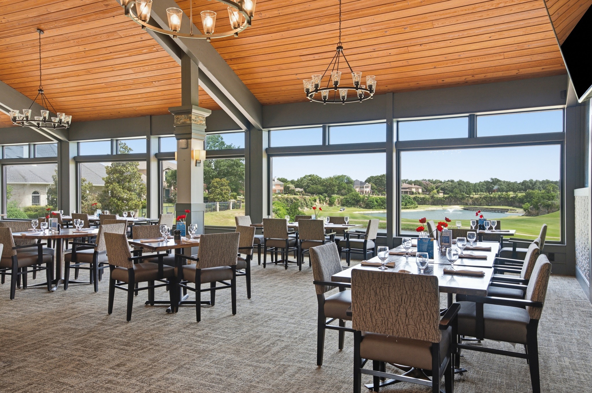 30115 Sawgrass Trail Georgetown, TX 78628 - Photo 29 of 37 A spacious dining area offers panoramic views of a pristine golf course and a serene lake.