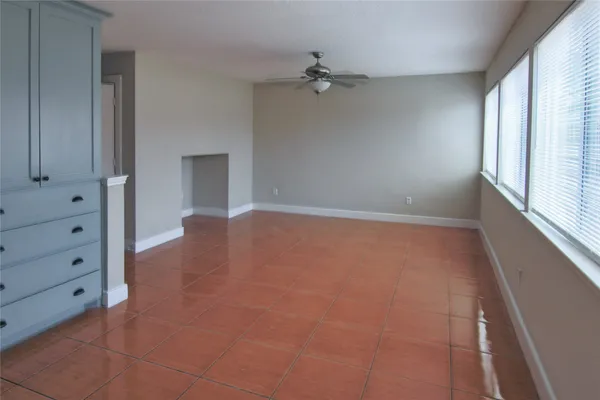 a view of an empty room with a window