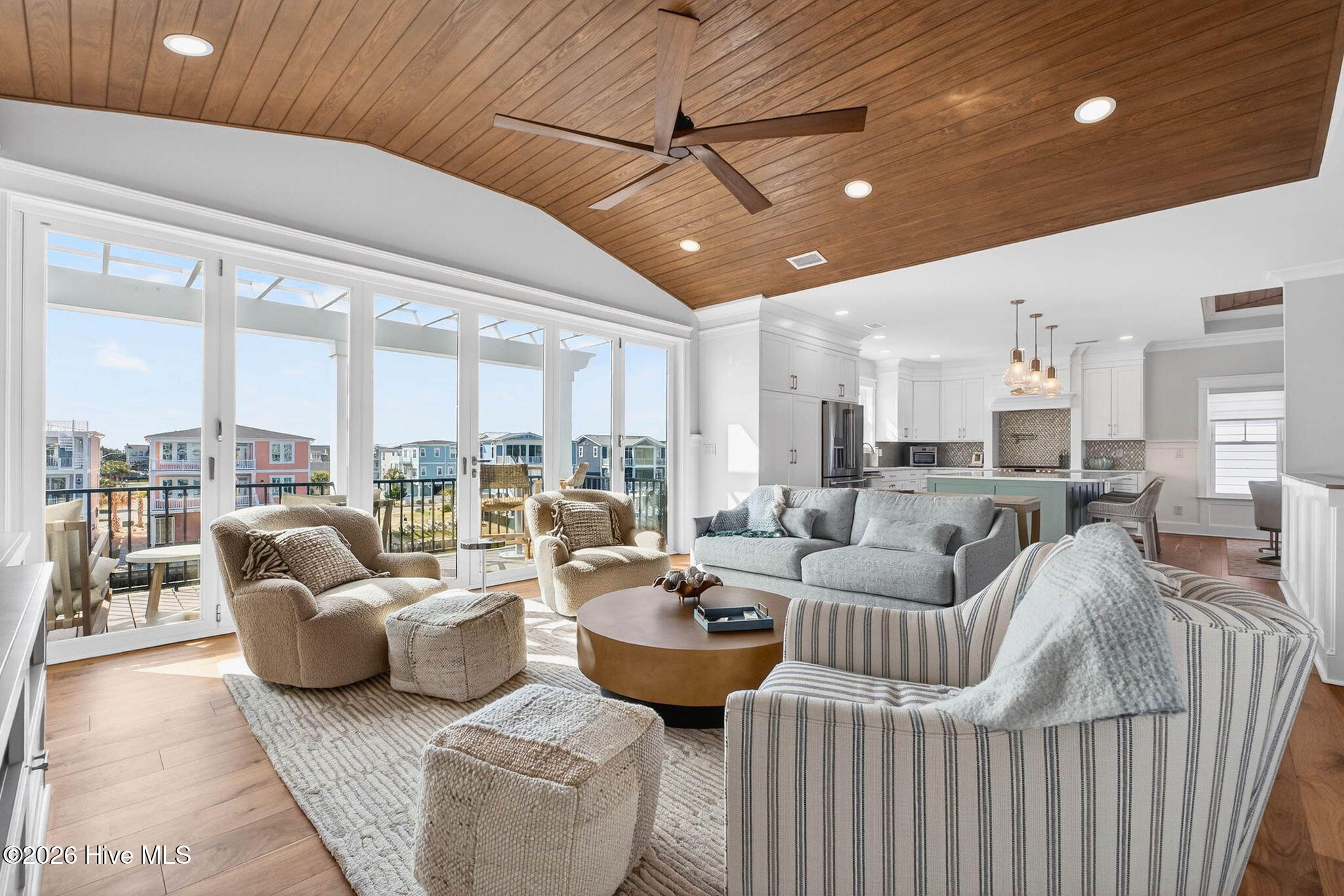 1416 Riverside Drive Sunset Beach, NC 28468 - Photo 17 of 83 Open living area with high-end finishes, vaulted ceilings, and seamless indoor-outdoor flow.