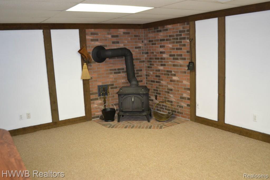 5205 Old Mill Road Rochester, MI 48306 - Photo 50 of 61 49-Charming Wood Burning Stove.jpg