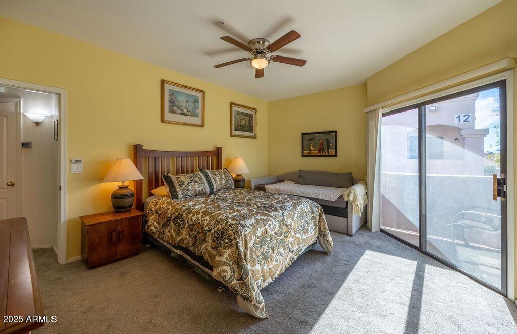 9151 West Greenway Road, Unit 273 Peoria, AZ 85381 - Photo 16 of 24 a bedroom with a bed and window