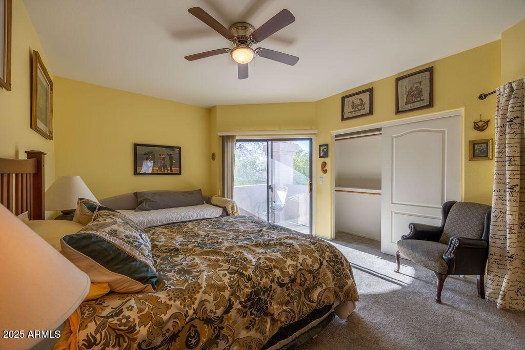 9151 West Greenway Road, Unit 273 Peoria, AZ 85381 - Photo 21 of 24 a bedroom with a bed couch and a window
