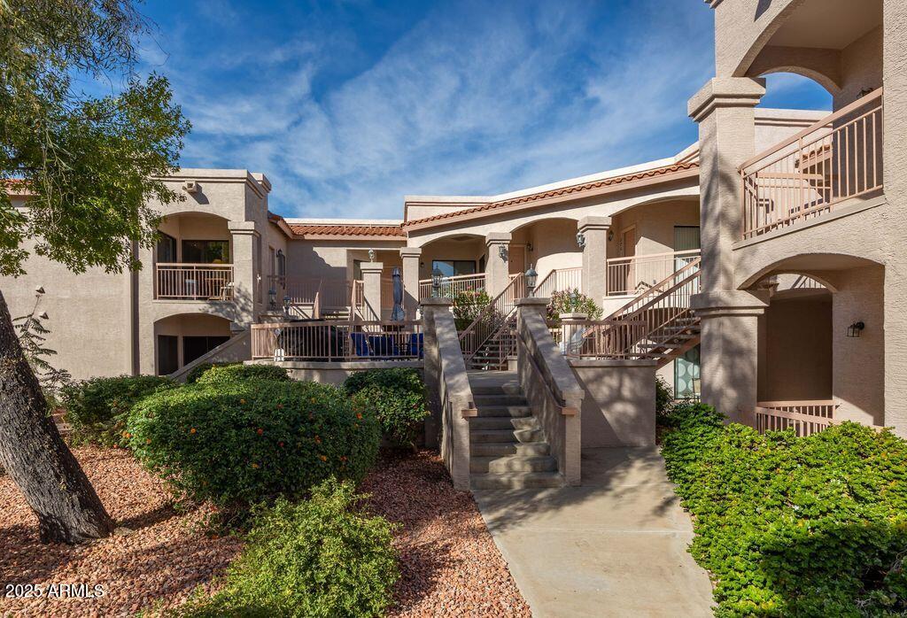 9151 West Greenway Road, Unit 273 Peoria, AZ 85381 - Photo 6 of 24 a front view of a house with balcony