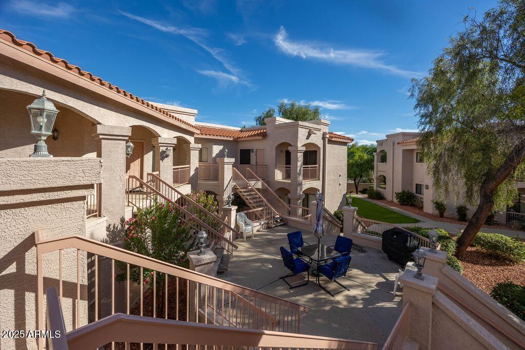 9151 West Greenway Road, Unit 273 Peoria, AZ 85381 - Photo 8 of 24 a view of a house with backyard and sitting area