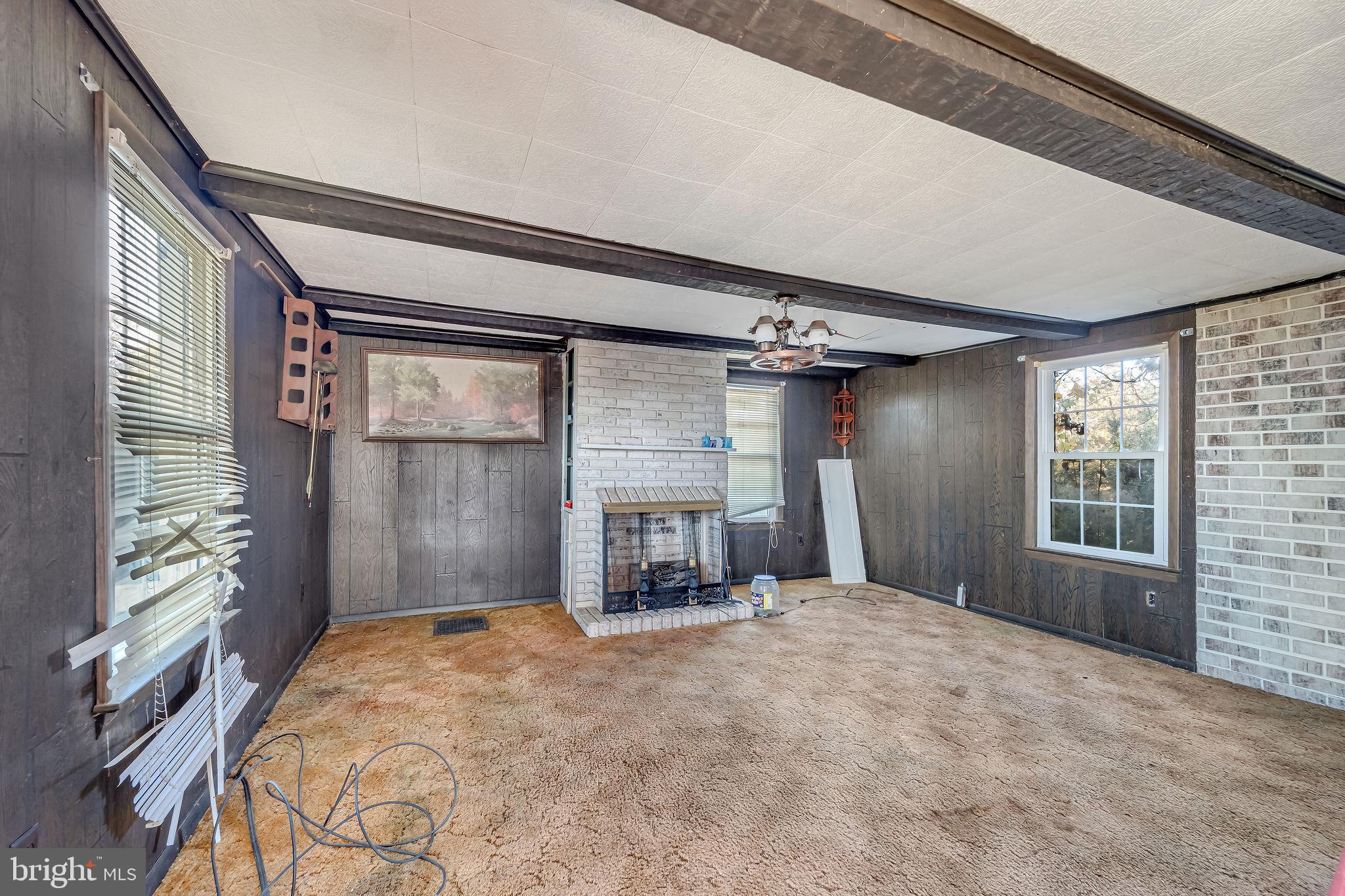 321 Jones Island Road Cedarville, NJ 08311 - Photo 17 of 39 a bedroom with a bed and a large window with outer view