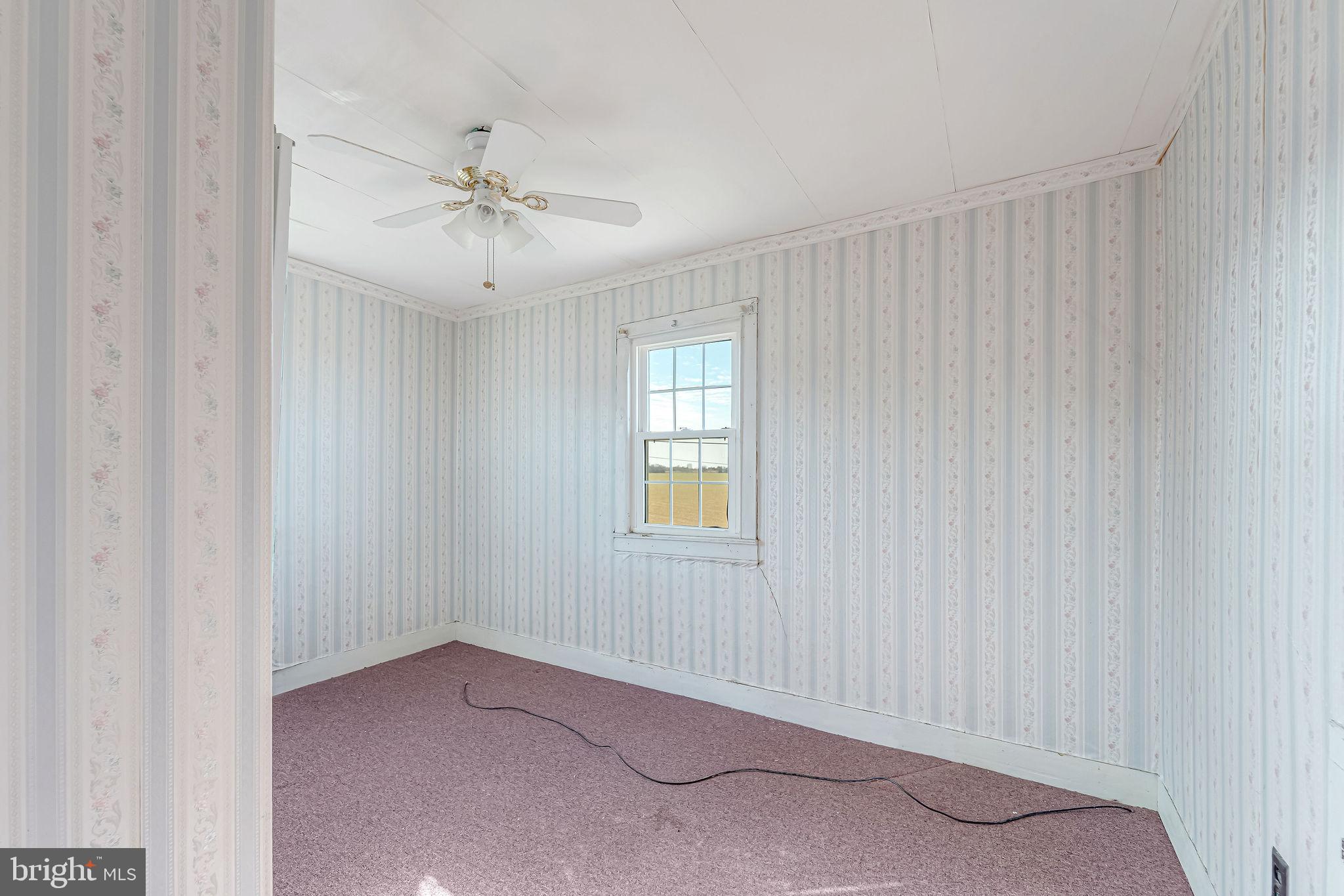 321 Jones Island Road Cedarville, NJ 08311 - Photo 27 of 39 an empty room with windows and fan