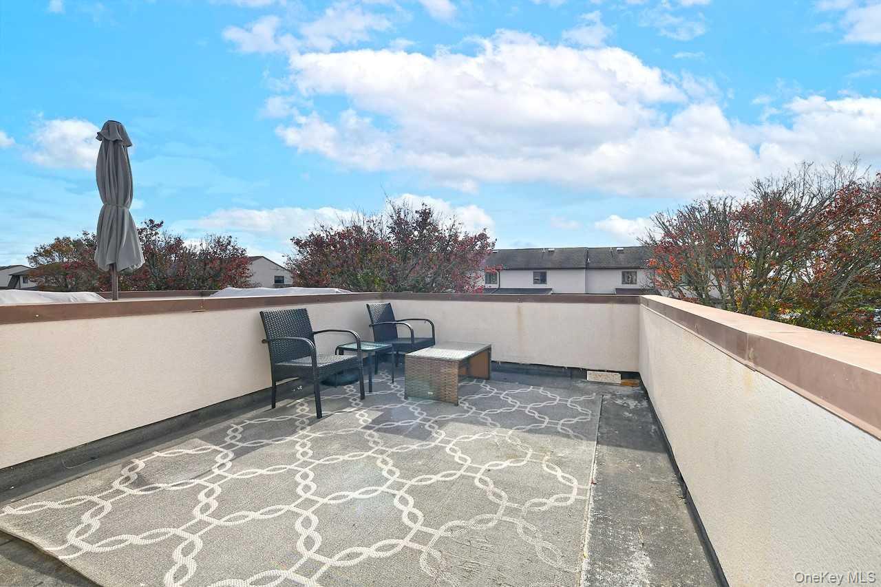 1 Anchorage Way, Unit 1408 Freeport, NY 11520 - Photo 16 of 25 a view of a terrace with sitting area
