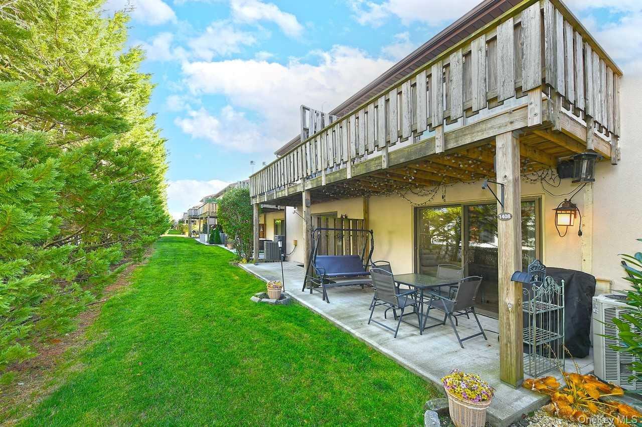 1 Anchorage Way, Unit 1408 Freeport, NY 11520 - Photo 22 of 25 a view of a house with a yard