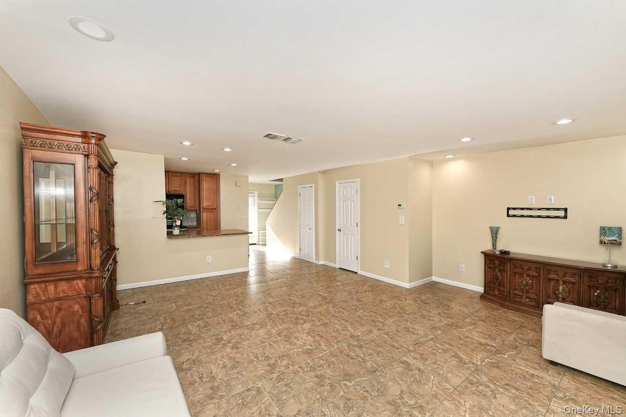 1 Anchorage Way, Unit 1408 Freeport, NY 11520 - Photo 8 of 25 a view of kitchen with refrigerator and window