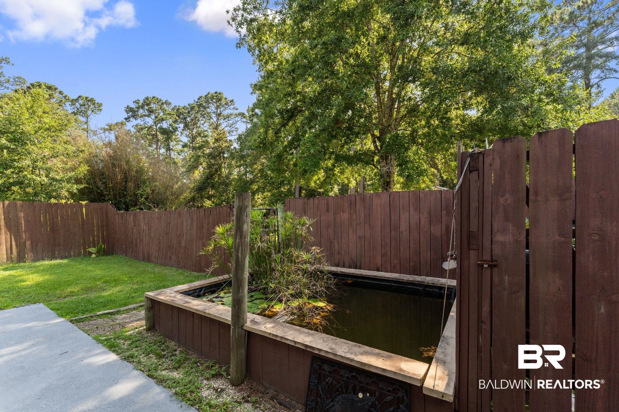 14095 Riverside Drive Foley, AL 36535 - Photo 30 of 30 Fenced backyard featuring a gate