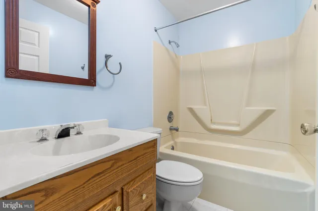 a bathroom with a sink a toilet and a bathtub