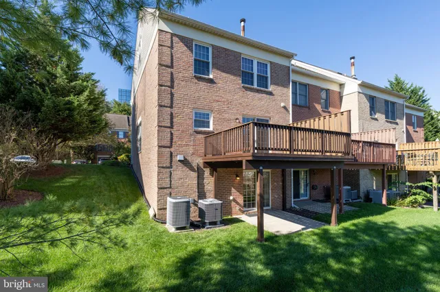 a view of a house with a yard porch and sitting area