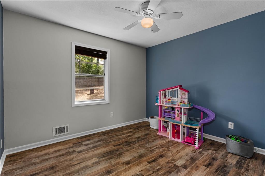 3990 Pine Mountain Road Northwest Kennesaw, GA 30152 - Photo 20 of 32 a view of a room with toys and wooden floor