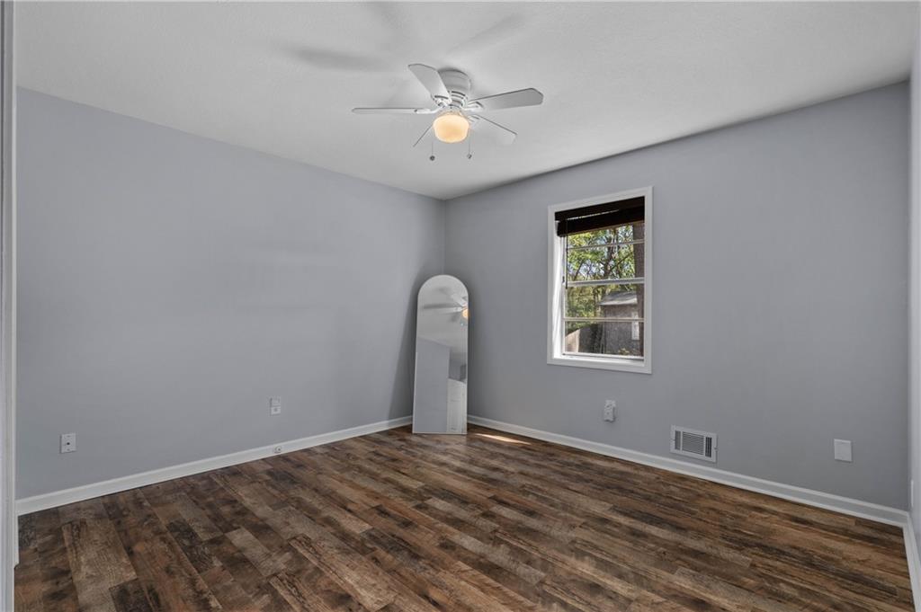 3990 Pine Mountain Road Northwest Kennesaw, GA 30152 - Photo 22 of 32 a view of an empty room with a window