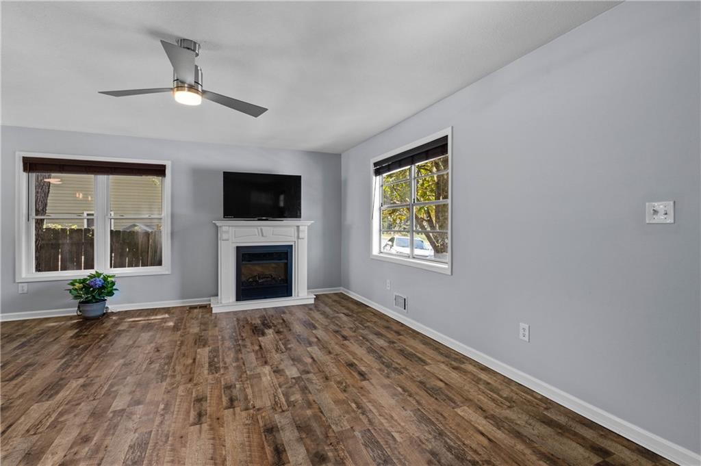 3990 Pine Mountain Road Northwest Kennesaw, GA 30152 - Photo 7 of 32 a view of a livingroom with a fireplace and window