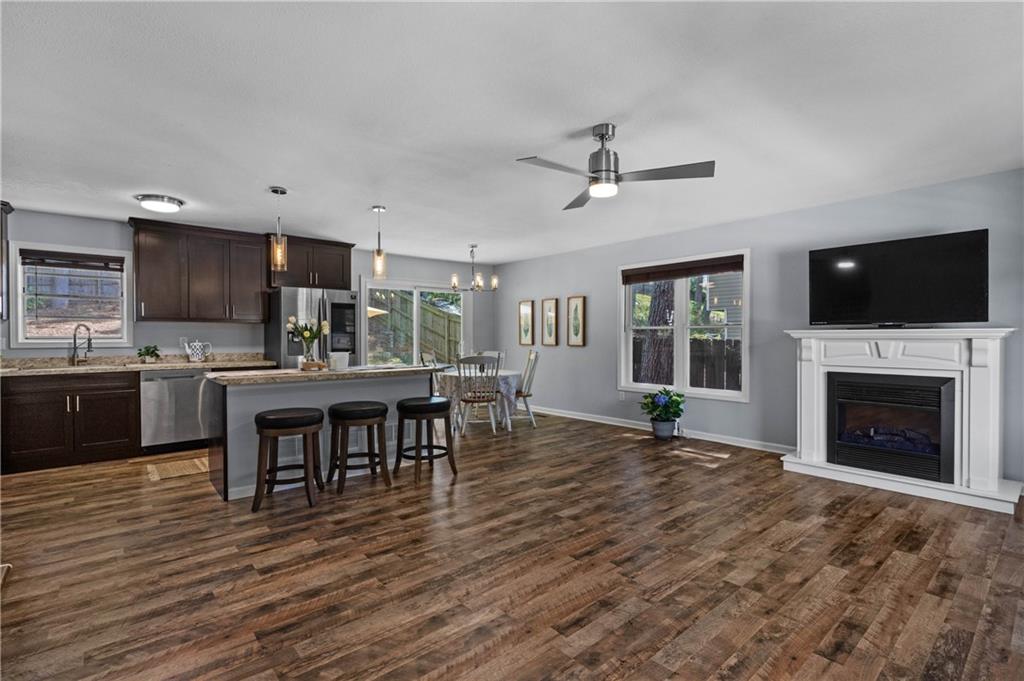 3990 Pine Mountain Road Northwest Kennesaw, GA 30152 - Photo 8 of 32 a open kitchen that has a lot of cabinets furniture and a wooden floor