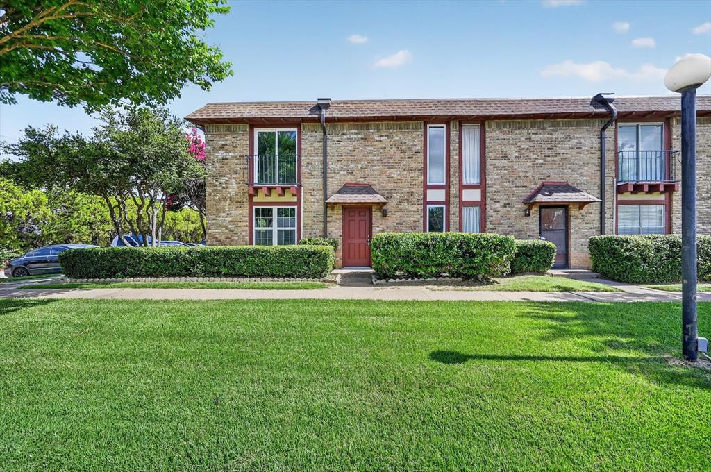 1801 East Grauwyler Road, Unit 101 Irving, TX 75061 - Photo 2 of 39 a front view of a house with garden