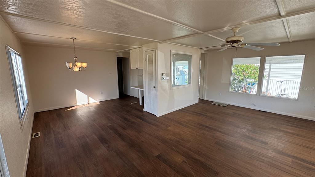 61 5th Avenue Venice, FL 34285 - Photo 13 of 35 an empty room with wooden floor and windows