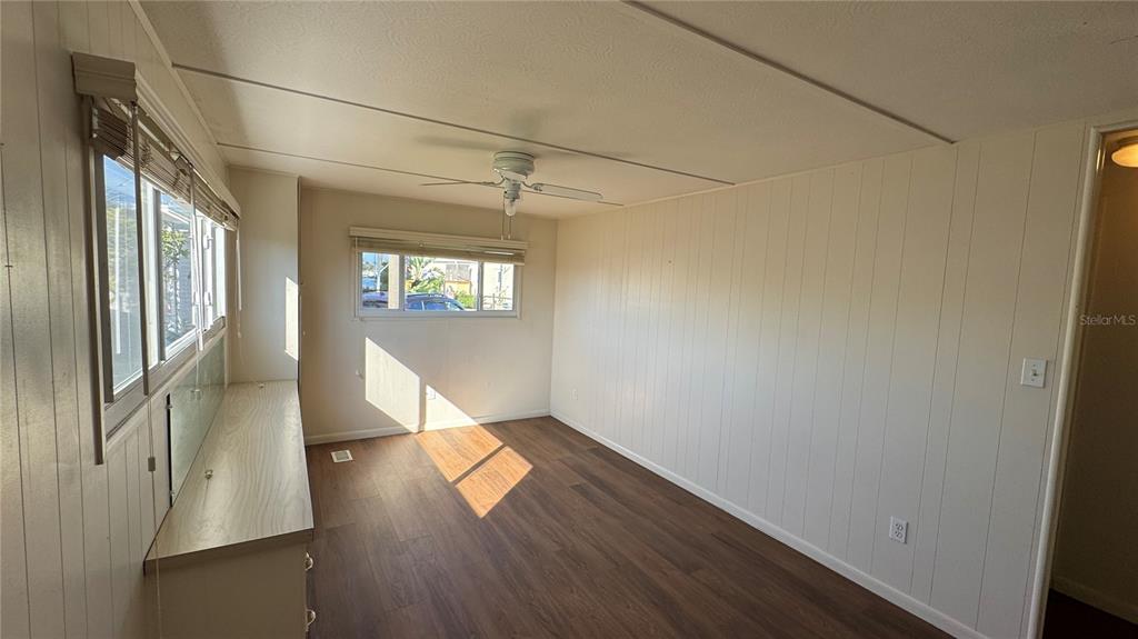 61 5th Avenue Venice, FL 34285 - Photo 14 of 35 an empty room with wooden floor and windows