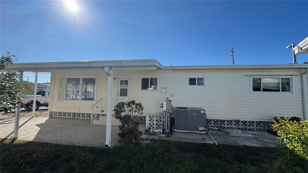 61 5th Avenue Venice, FL 34285 - Photo 2 of 35 a backyard of a house with table and chairs