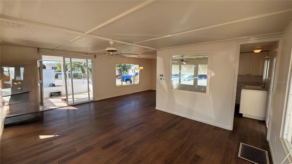 61 5th Avenue Venice, FL 34285 - Photo 6 of 35 an empty room with wooden floor and windows