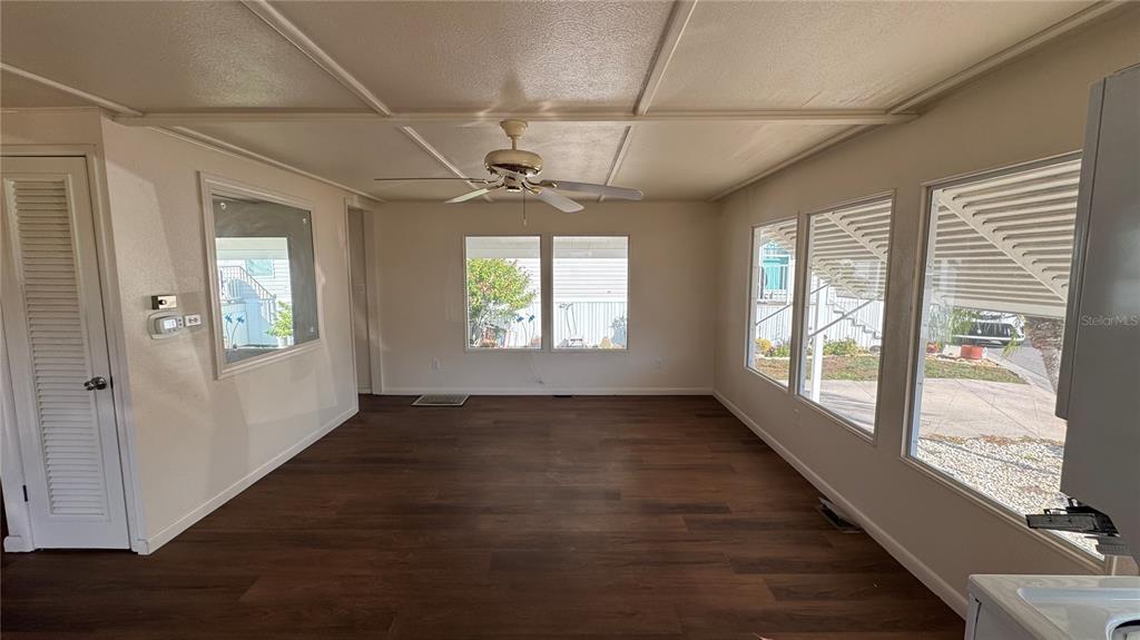 61 5th Avenue Venice, FL 34285 - Photo 7 of 35 a view of an empty room with wooden floor and a window