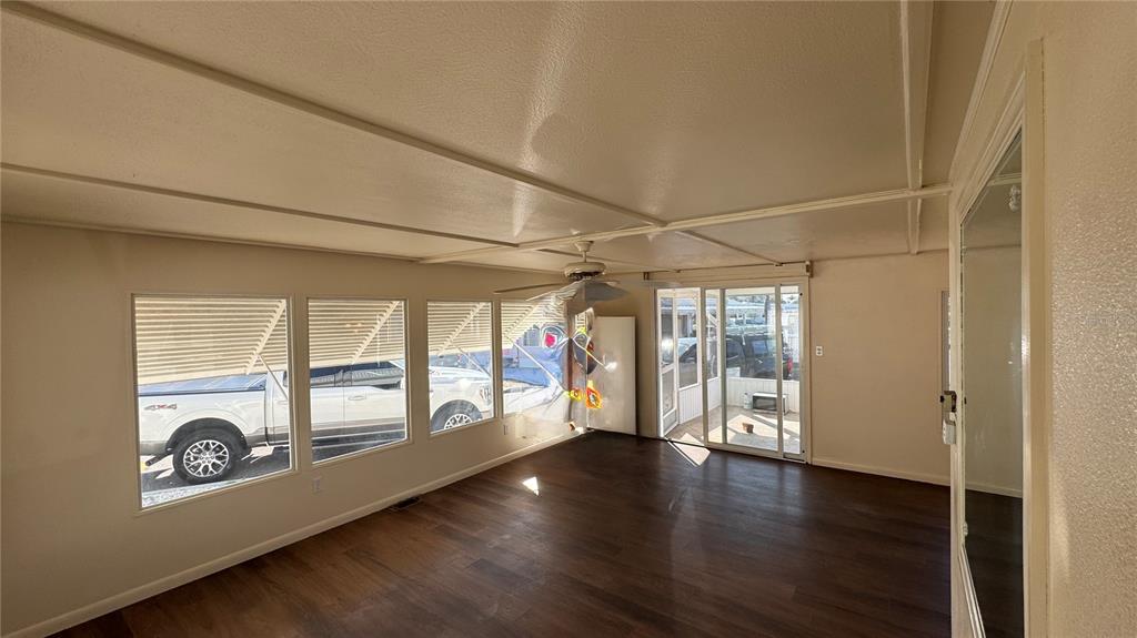 61 5th Avenue Venice, FL 34285 - Photo 8 of 35 an empty room with wooden floor and windows